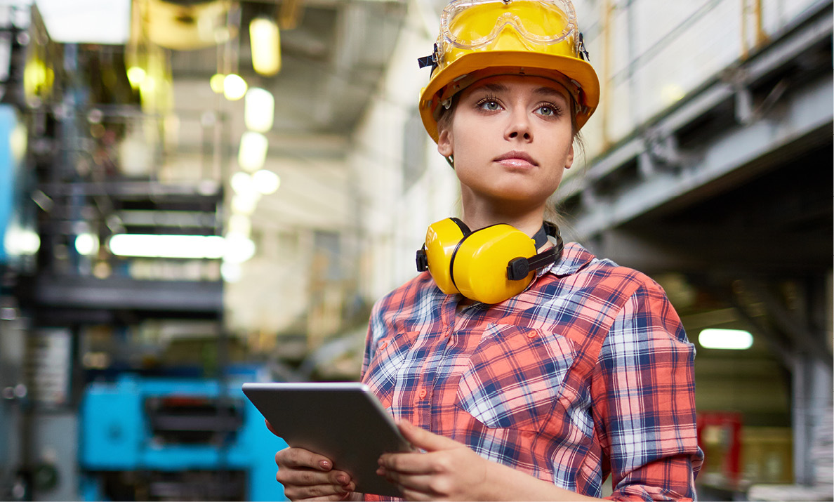 employee assessing energy usage in a factory